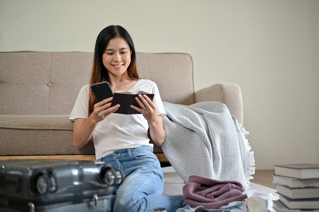A Beautiful Asian Woman checks her passport